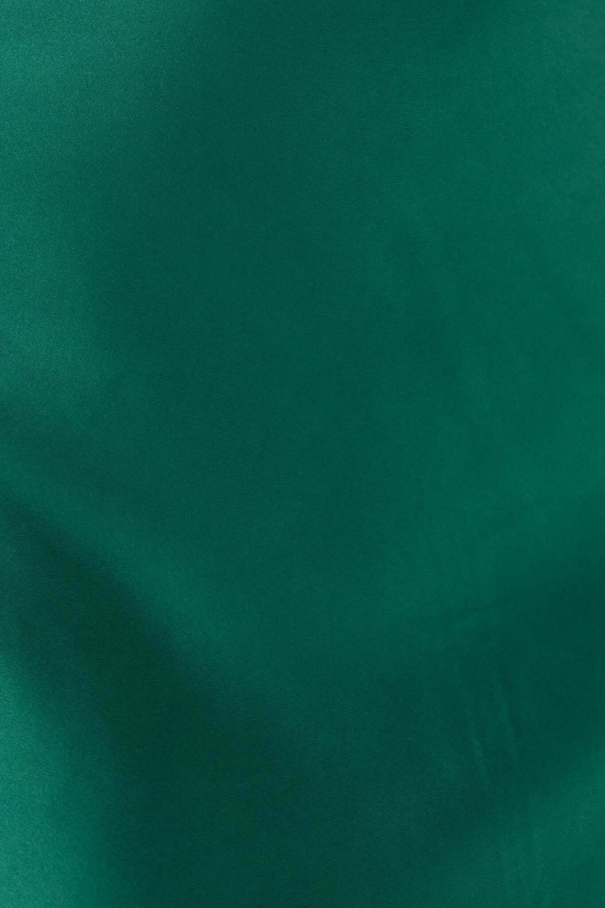 Close-up of green satin fabric showcasing texture for Janiyah Maxi Dress by Amaroso Bridal.