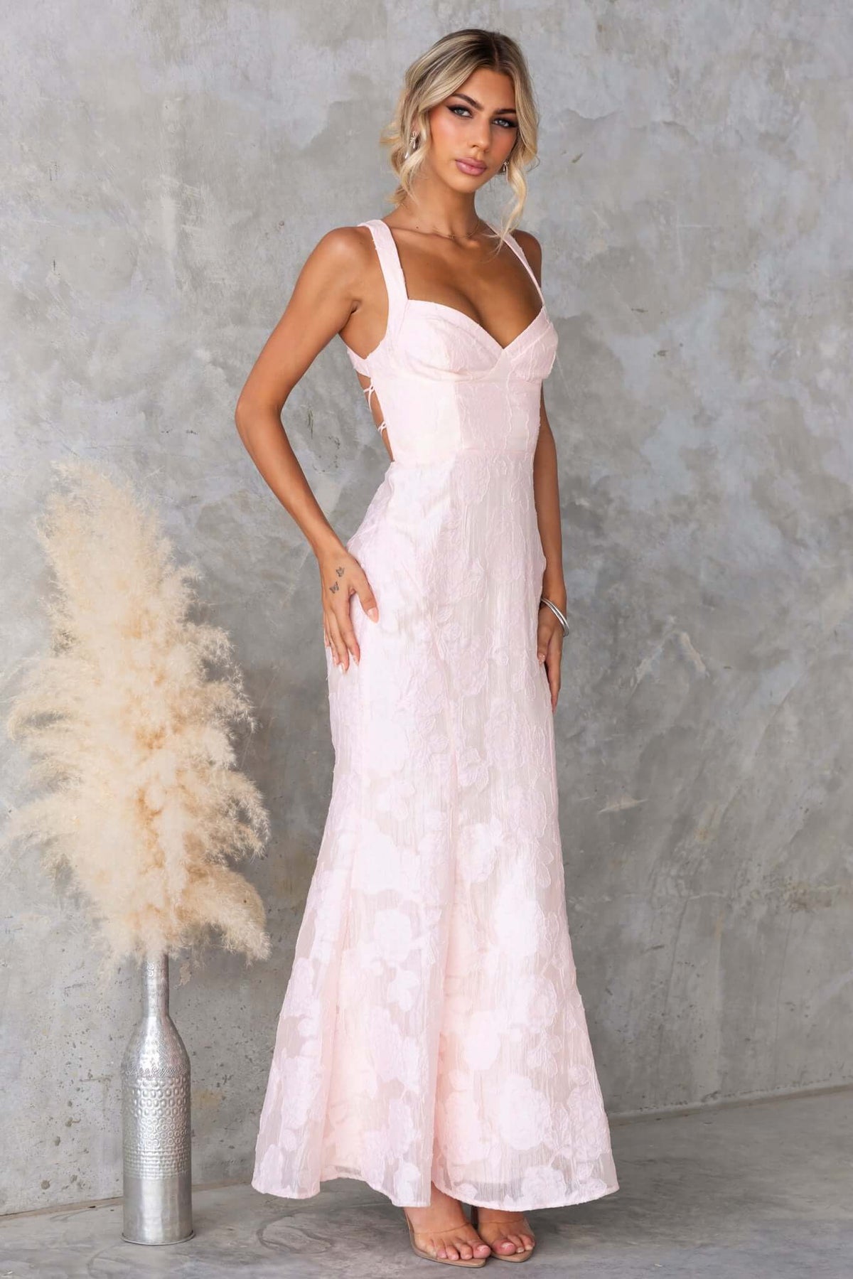 Remma Maxi Dress in soft pink lace, featuring a fitted bodice and slight fishtail hem, perfect for bridal occasions.