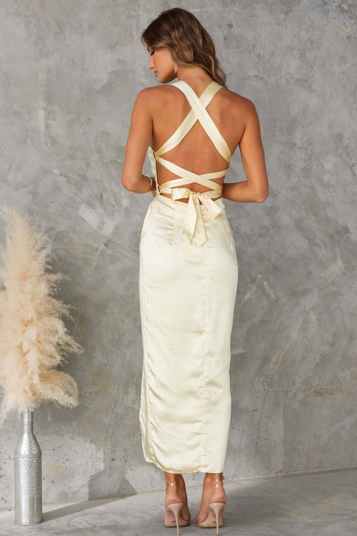 Back view of the Merritt Maxi Dress with adjustable tie straps and satin finish, perfect for elegant occasions.