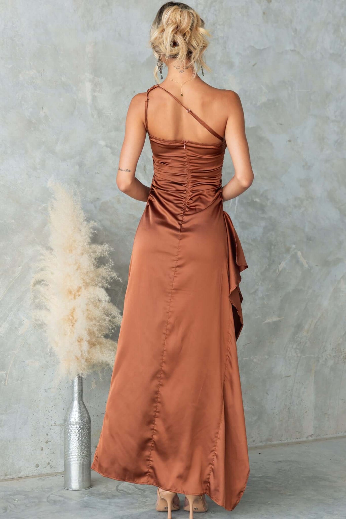 Back view of Dimmi Maxi Dress in satin, featuring asymmetrical hemline and ruched detailing.