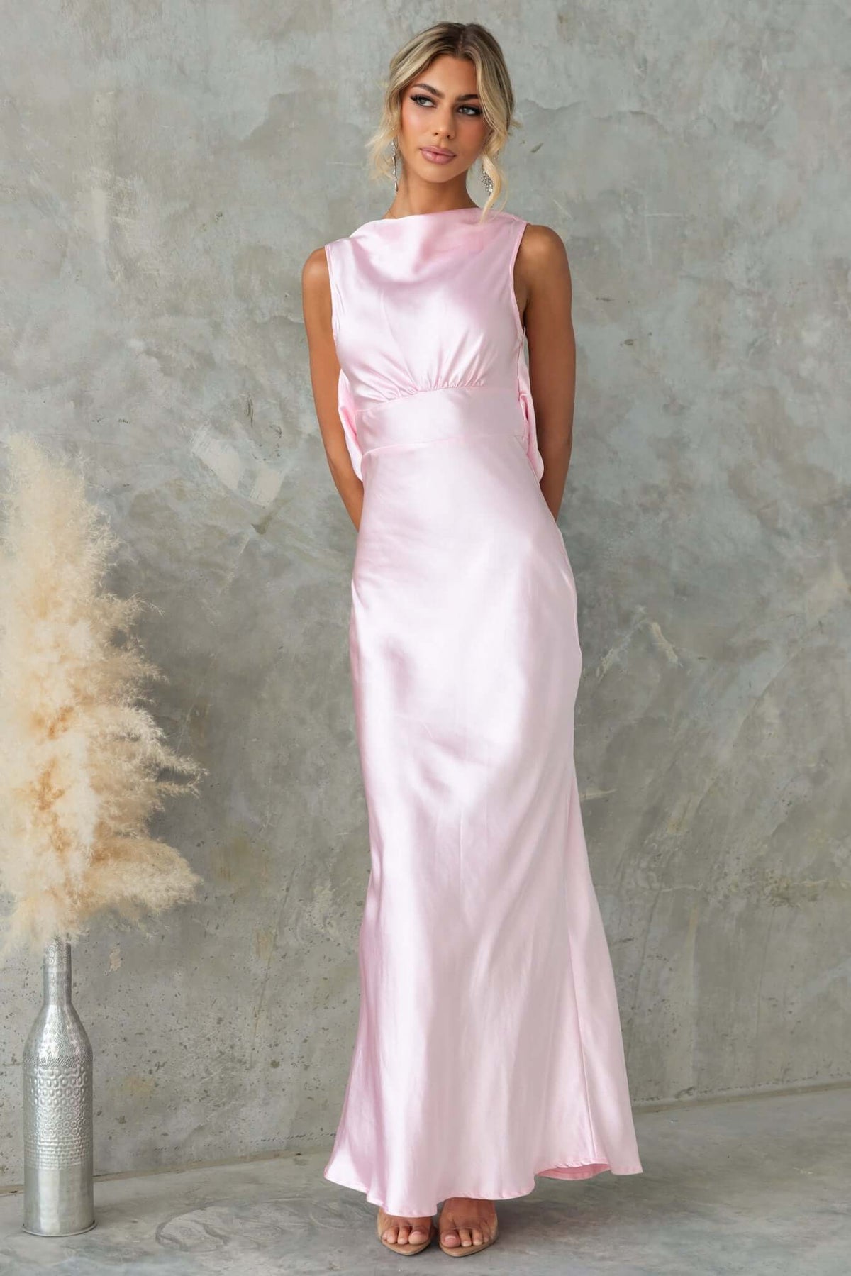 Silvia Maxi Dress in soft pink satin with a boat neckline and elegant draping, perfect for bridal occasions.