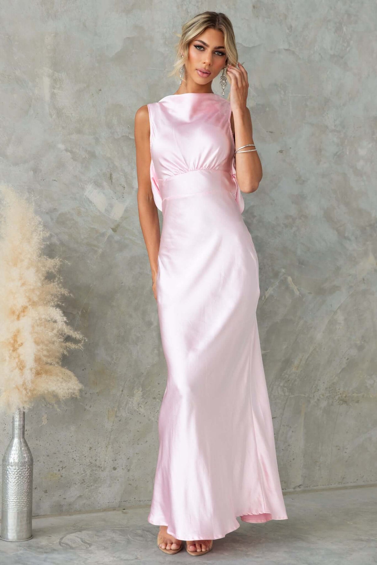 Silvia Maxi Dress in soft pink satin, featuring a boat neckline and draped back, perfect for elegant occasions.