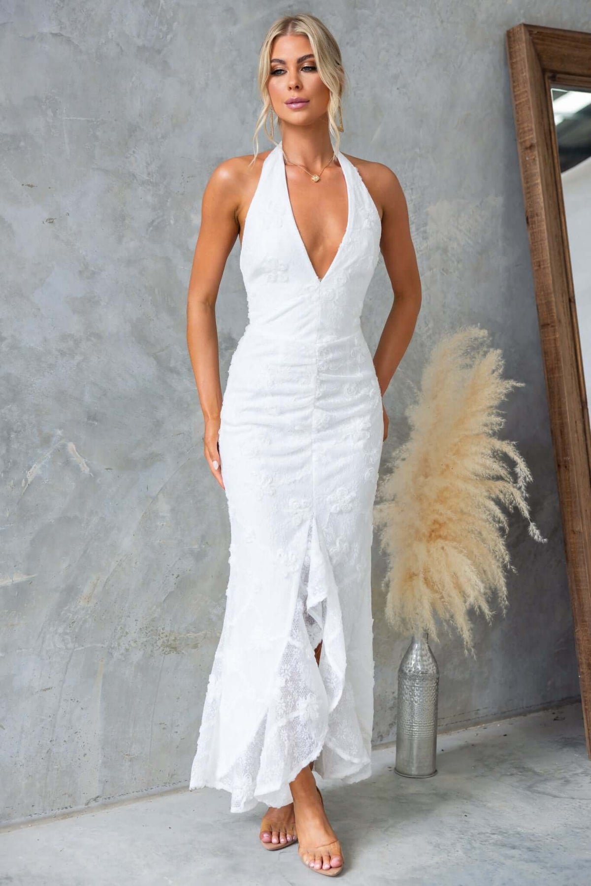 Metrick Maxi Dress by Amaroso Bridal, featuring a halter V-neckline and fishtail hem in textured white fabric.