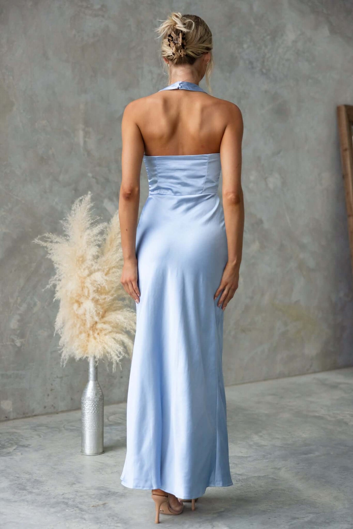 Back view of Abigail Maxi Dress in satin, featuring halter neckline and side invisible zip.