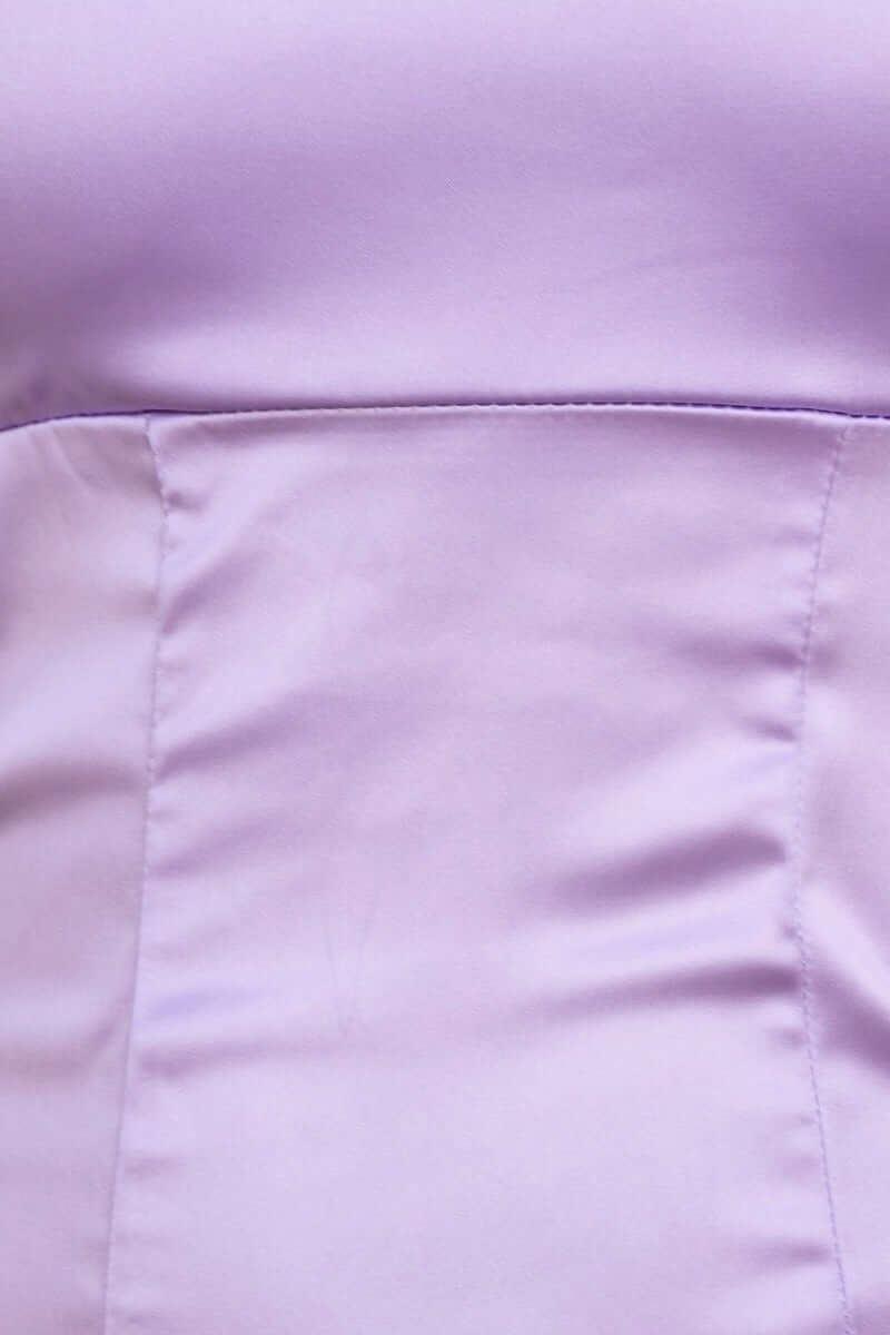 Close-up of the Suki Dress in soft lilac satin, showcasing smooth texture and elegant fit.