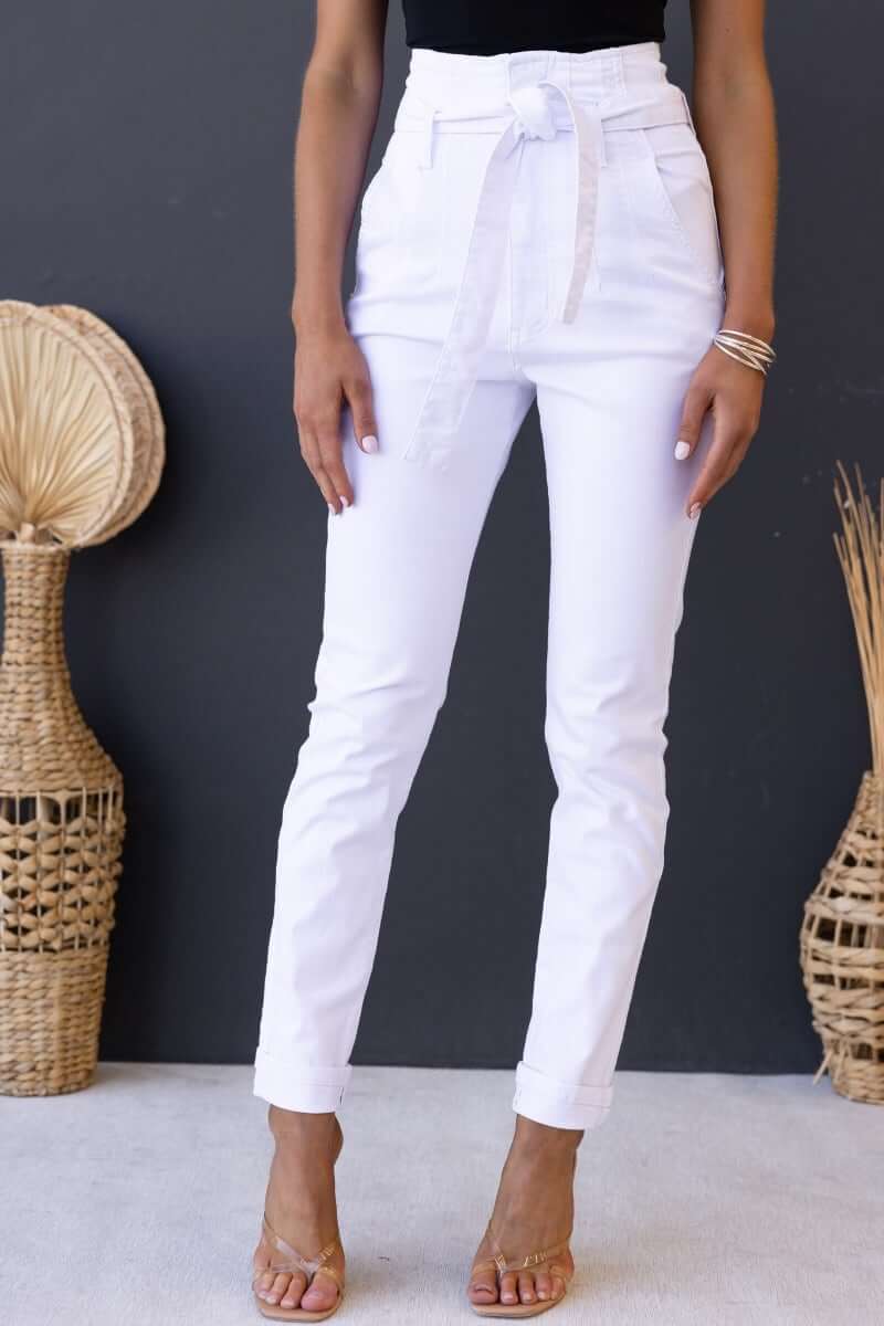 High waist white paper bag jeans with removable belt, front and back pockets, perfect for a standard fit.