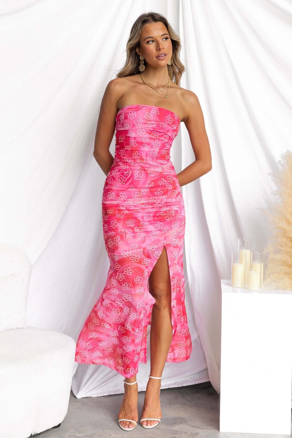 Blomma Midi Dress in pink floral print with front split, strapless design, showcasing elegant summer fashion.