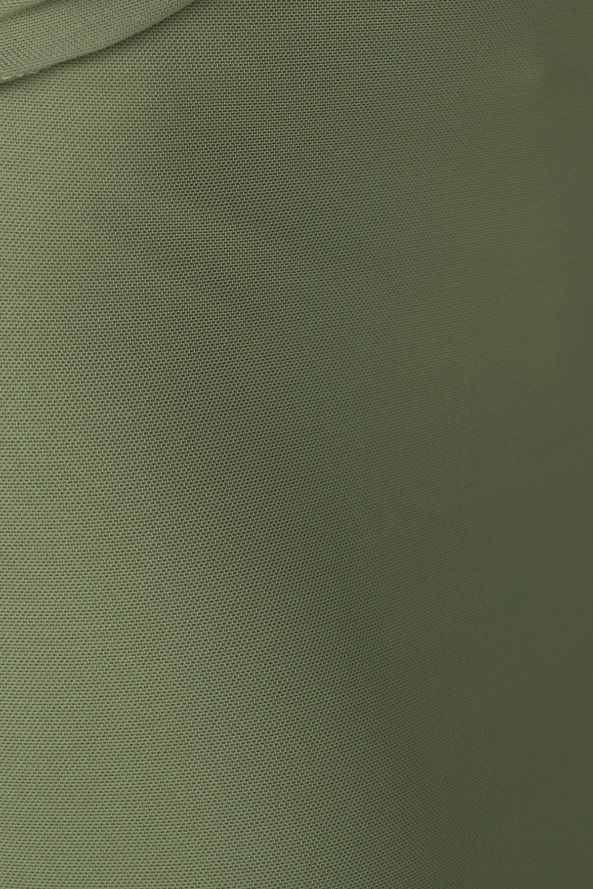 Close-up of soft green fabric texture, highlighting the material details and stretch for Denham Maxi Dress.