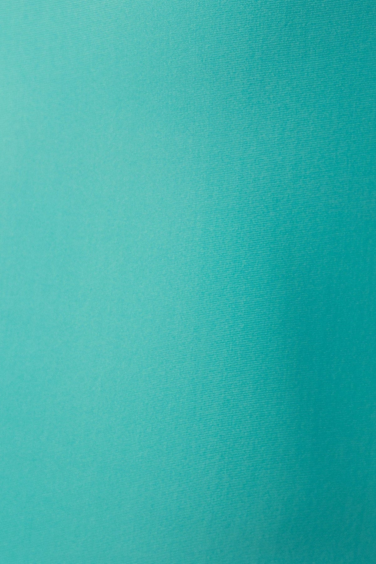 Close-up of slinky fabric in vibrant turquoise, showcasing smooth texture perfect for elegant dresses.