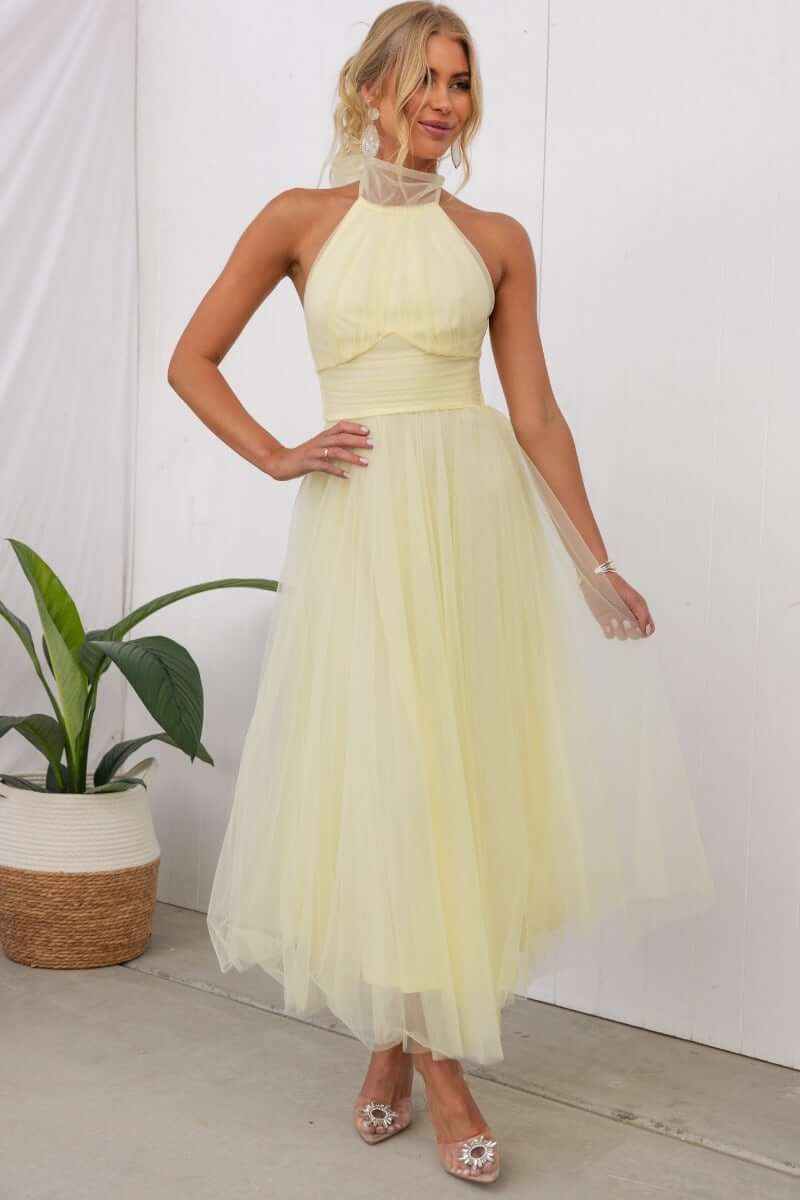 Love Lane Maxi Dress in soft yellow with adjustable halter neckline and gathered bodice, perfect for summer events.