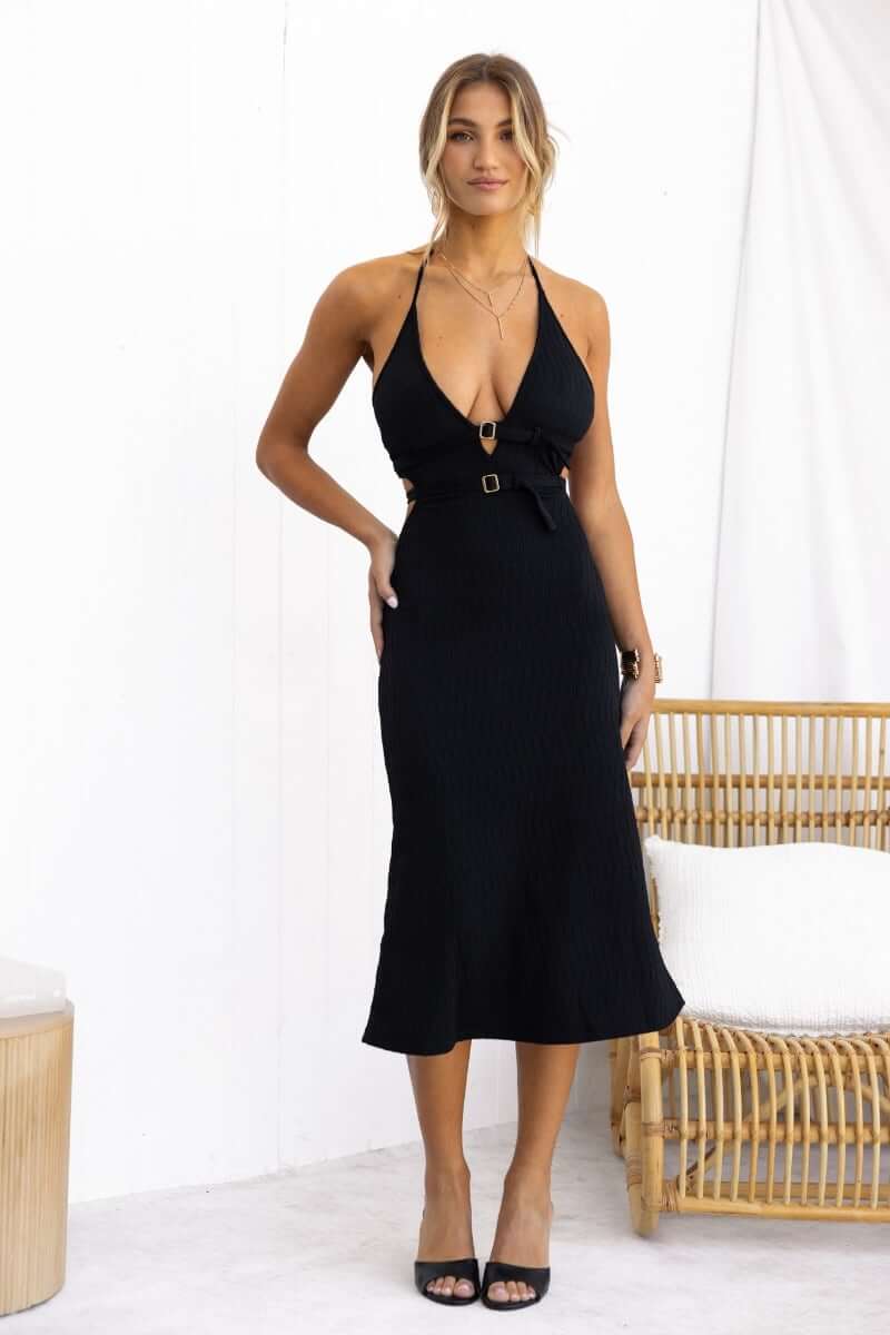 Black textured midi dress with adjustable halter neckline and buckle detail, showcasing a stylish fit.