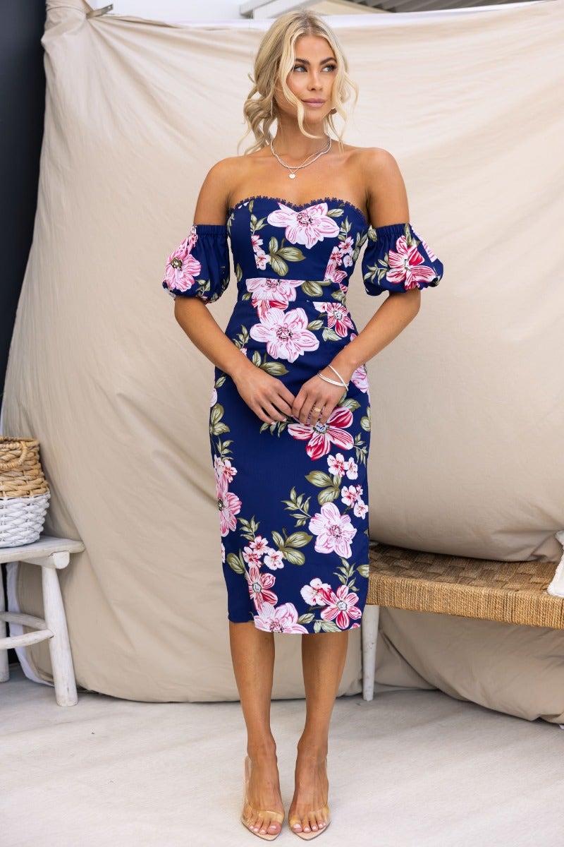 Navy floral print midi dress with off-shoulder neckline and elastic sleeve fittings, model wearing size 6/XS.