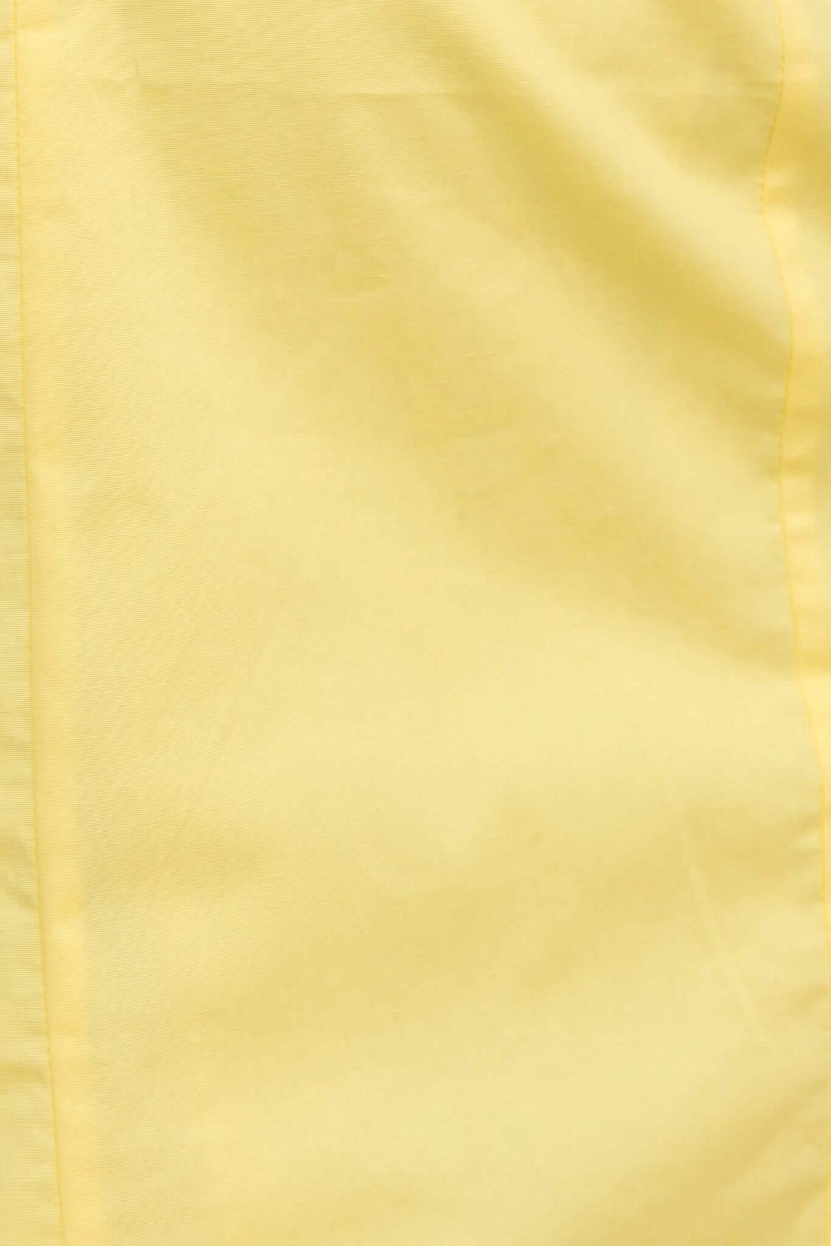 Close-up of soft yellow fabric, showcasing texture and color of the Hopewell Maxi Dress.