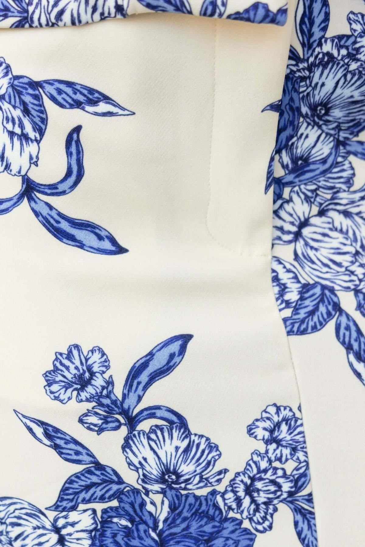 Close-up of floral pattern in blue and white on Wynter Maxi Skirt, showcasing fabric and design details.