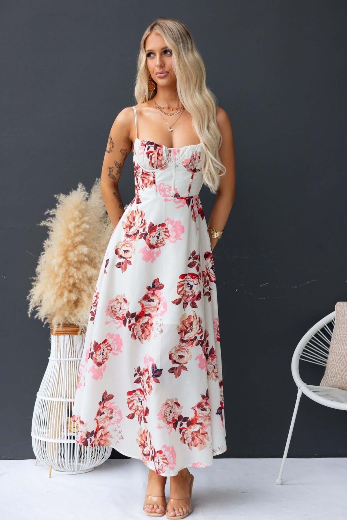 Burkes Midi Dress featuring floral pattern, adjustable tie straps, and split front design, perfect for spring and summer occasions.