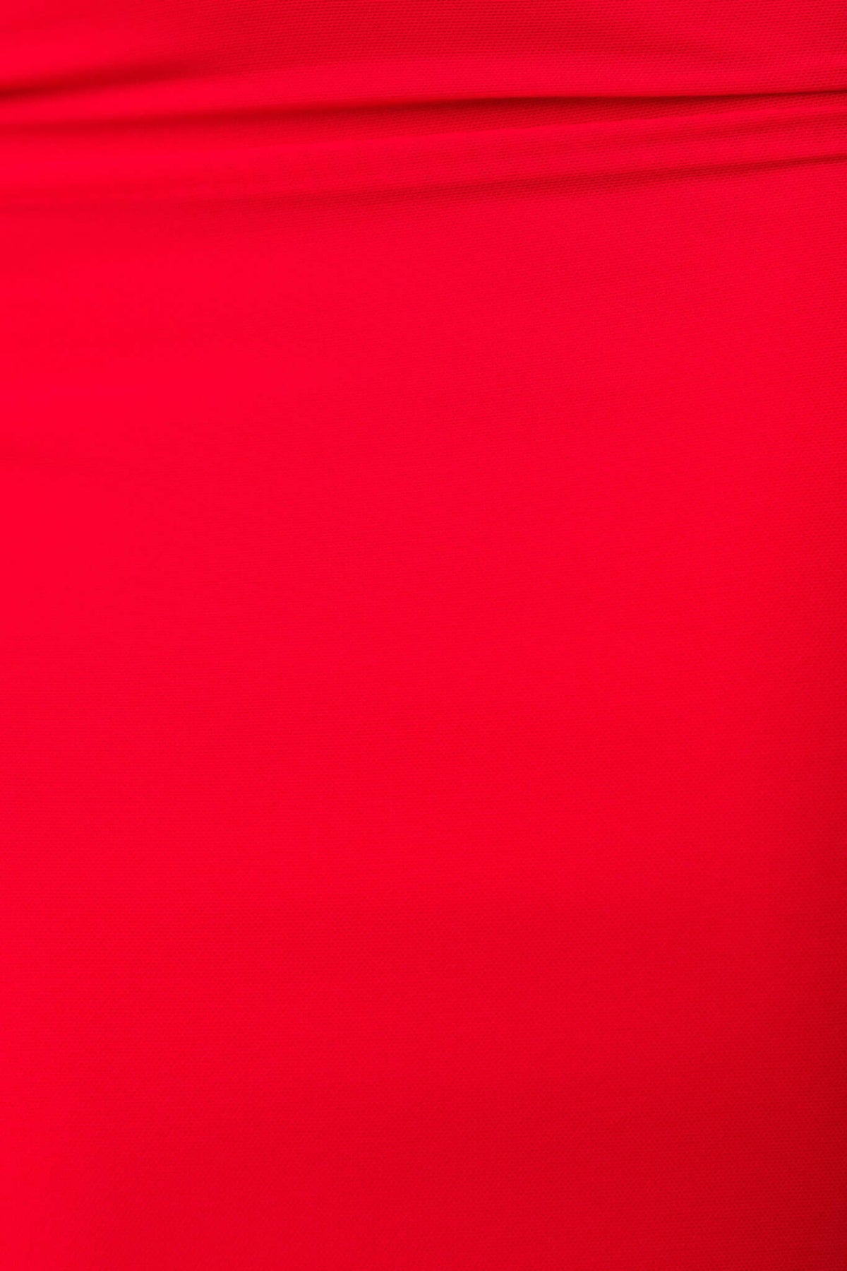 Close-up of vibrant red fabric of the Damsel Maxi Dress featuring a smooth, stretch material.