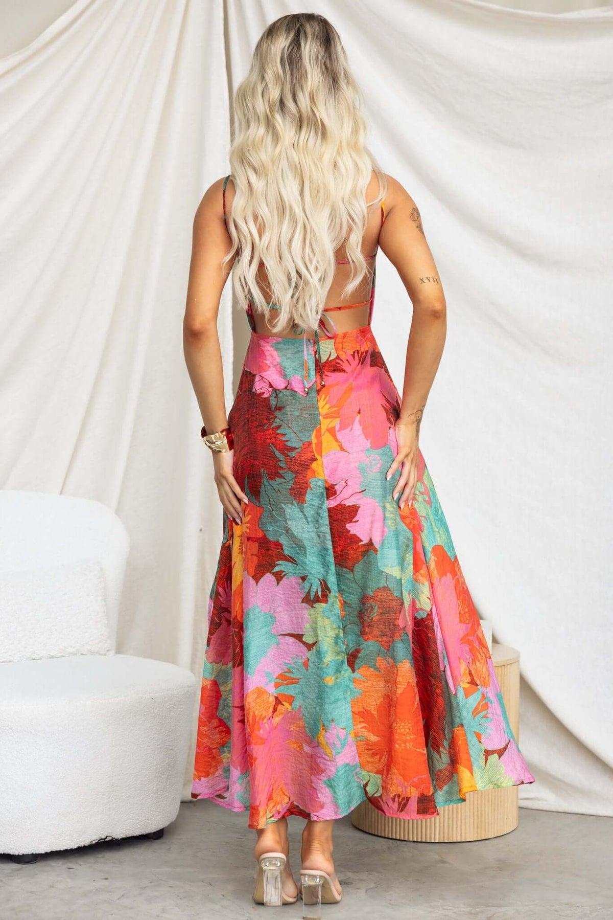 Back view of Burkes Midi Dress featuring colorful floral print and adjustable tie straps
