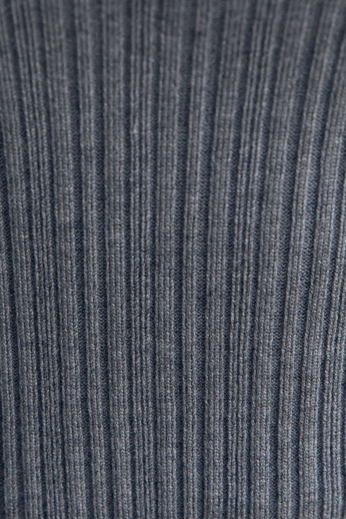 Close-up of ribbed knit fabric in dark grey, showcasing texture and stretch, perfect for Socker Top design.