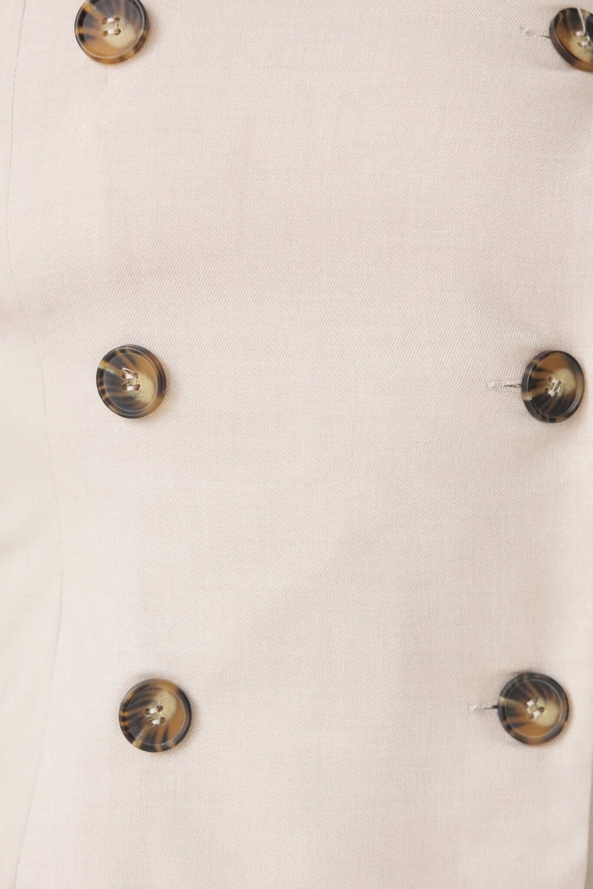 Close-up of the Lanetta Top showing non-functional buttons on a strapless, lined design.