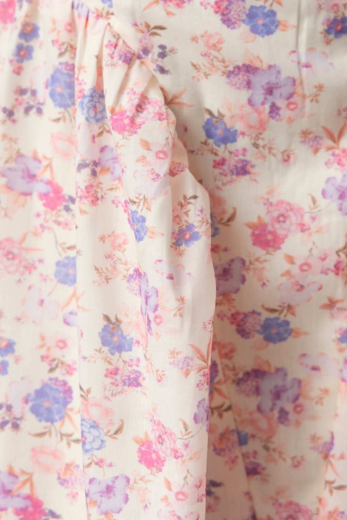 Close-up of floral pattern featuring pink and purple flowers on a light background for Othella Maxi Dress.