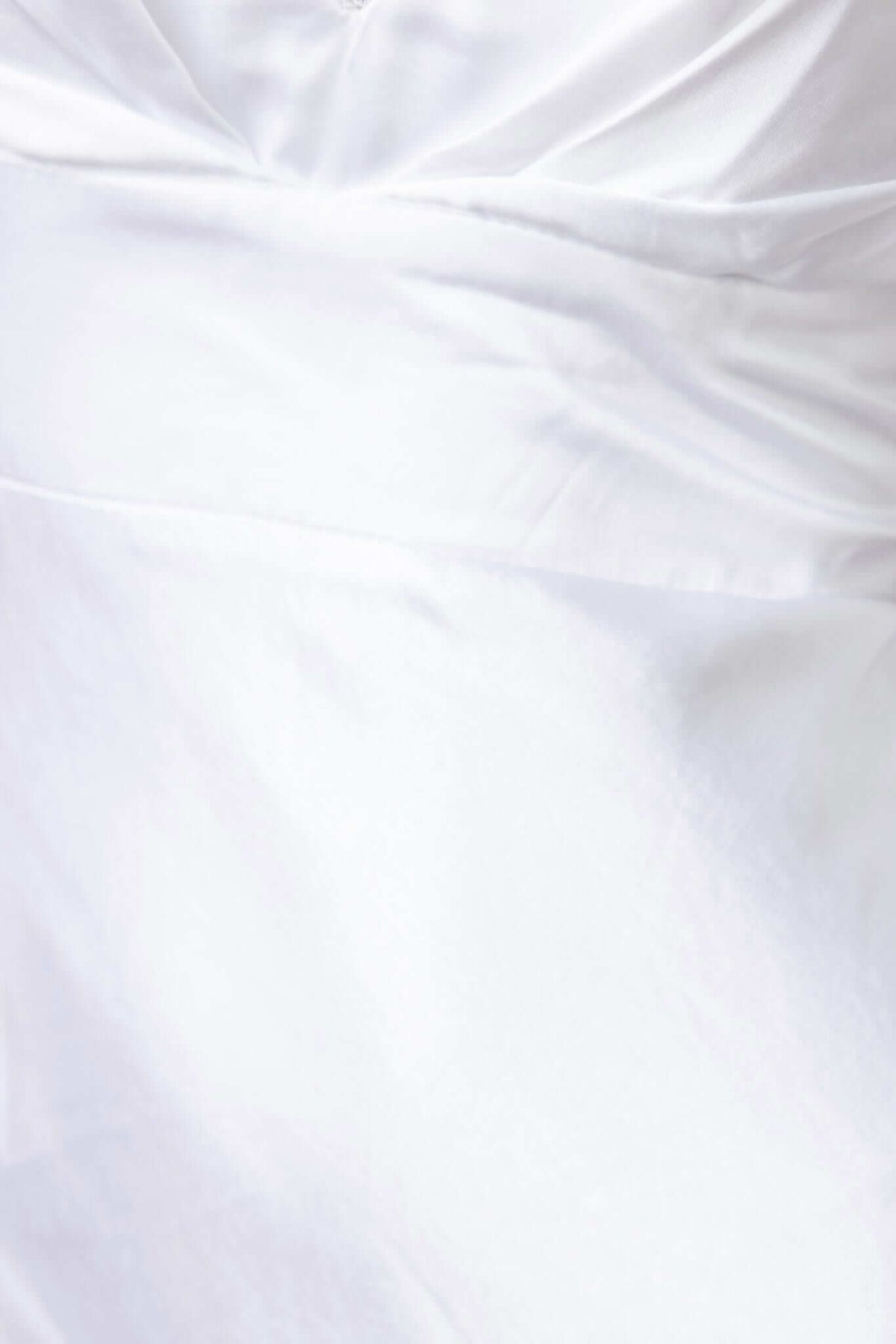 Close-up of the Maricia Maxi Dress highlighting the elegant fabric and design details.