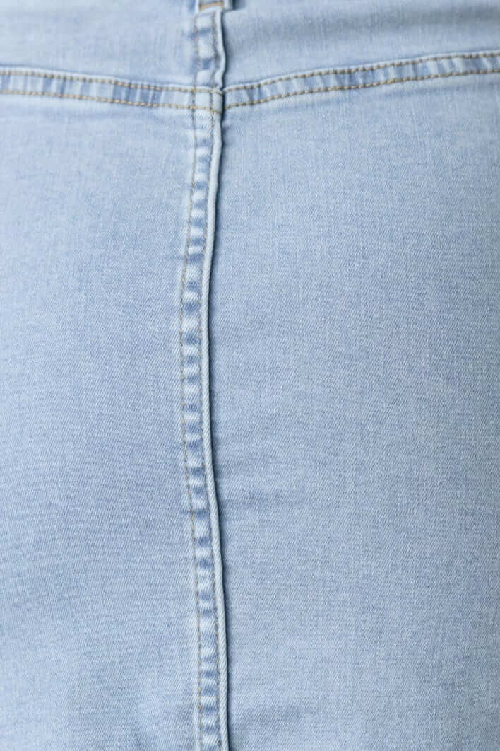 Close-up of the Kipper Denim Skirt showcasing the light blue fabric and detailed stitching.