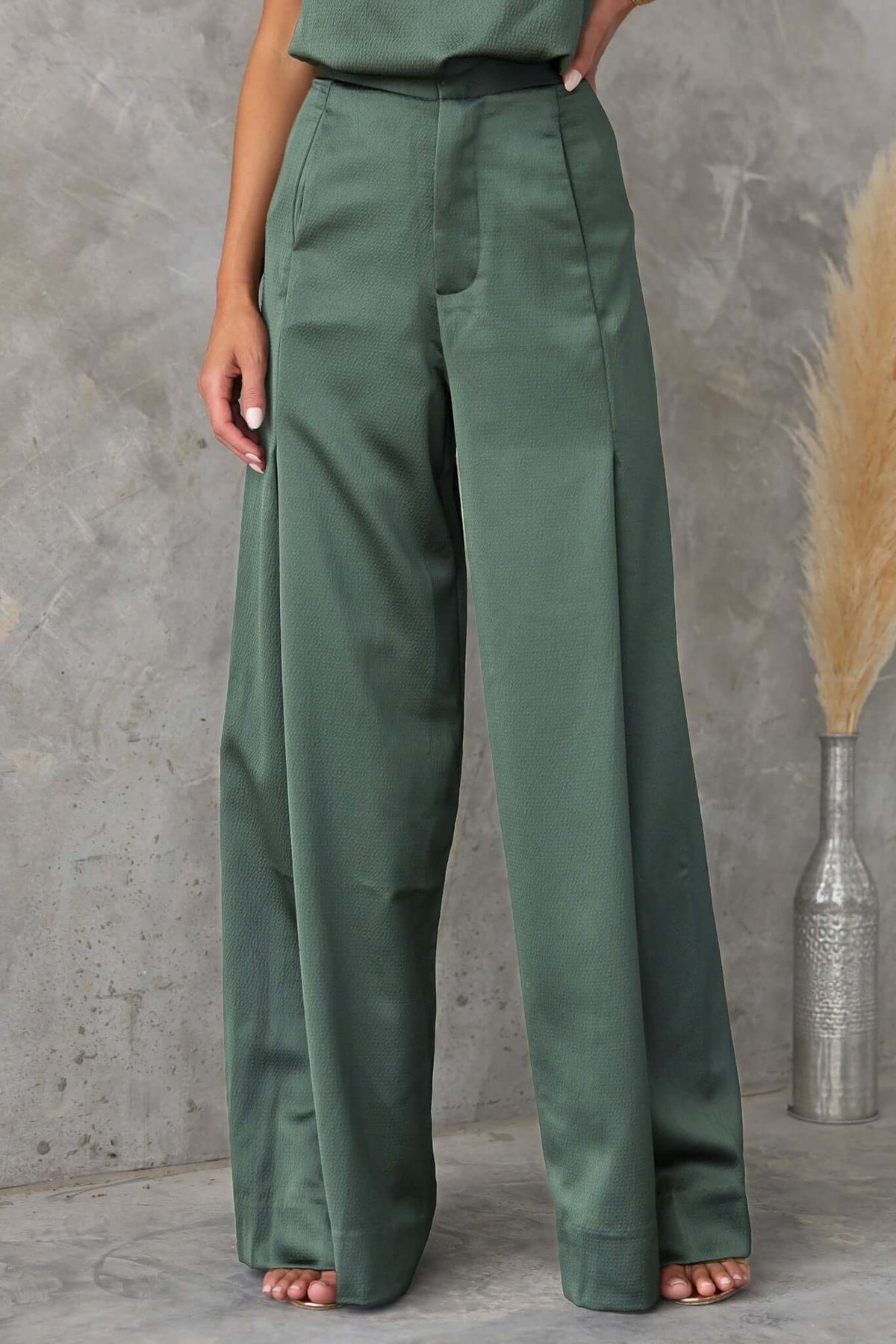 Hampton style pants in green with mid-high waist fit and wide legs, perfect for dressy occasions.