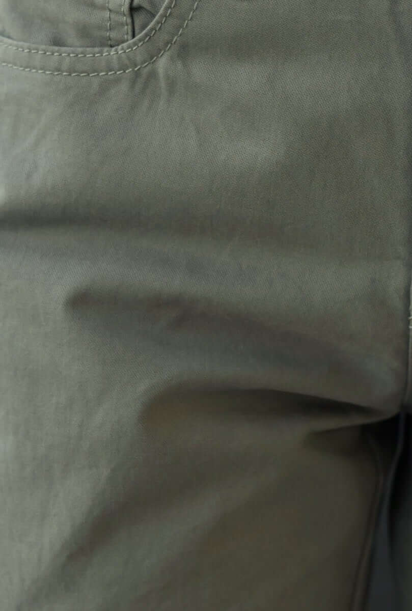 Close-up of Bowie Cargo Pants fabric showing detail and texture in olive green color.