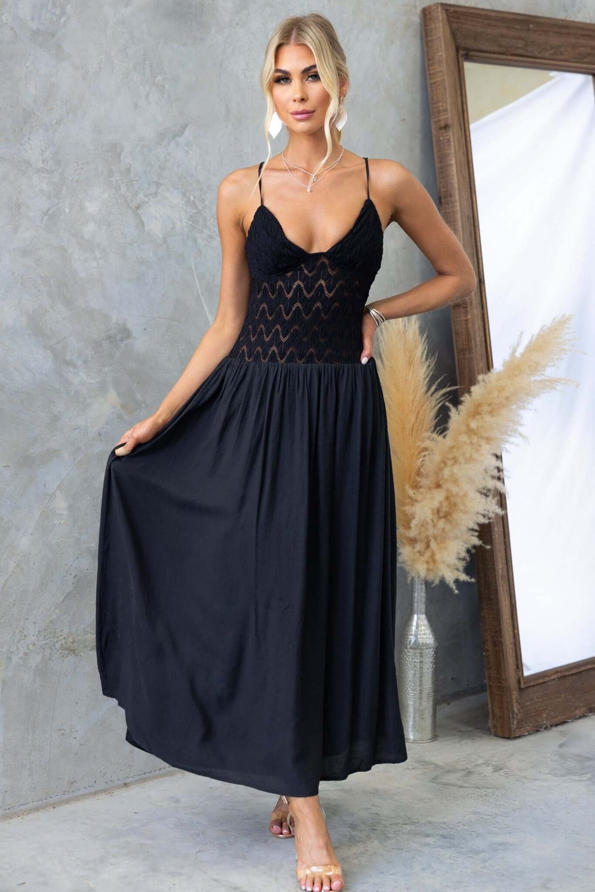 Black Thaisa maxi dress with adjustable straps and lace bodice, perfect for elegant occasions.