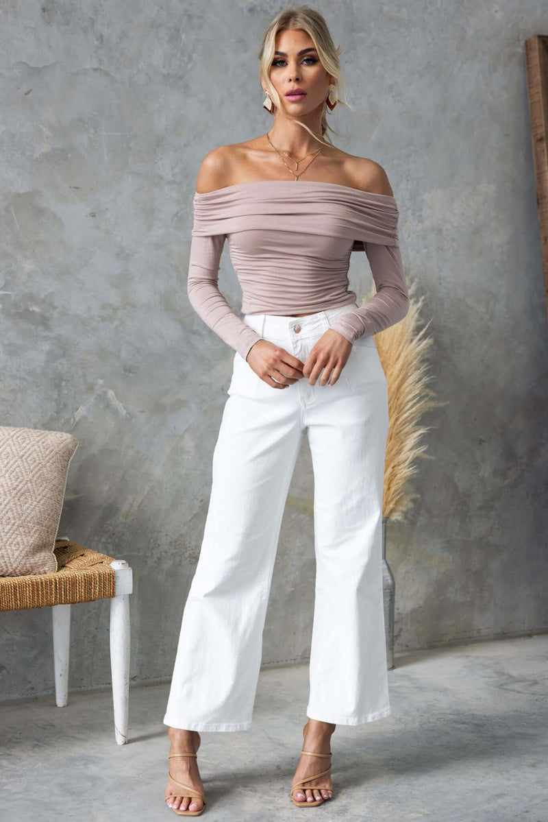 Model wearing off-the-shoulder top with Blanca Jeans, showcasing wide-leg fit and casual elegance.