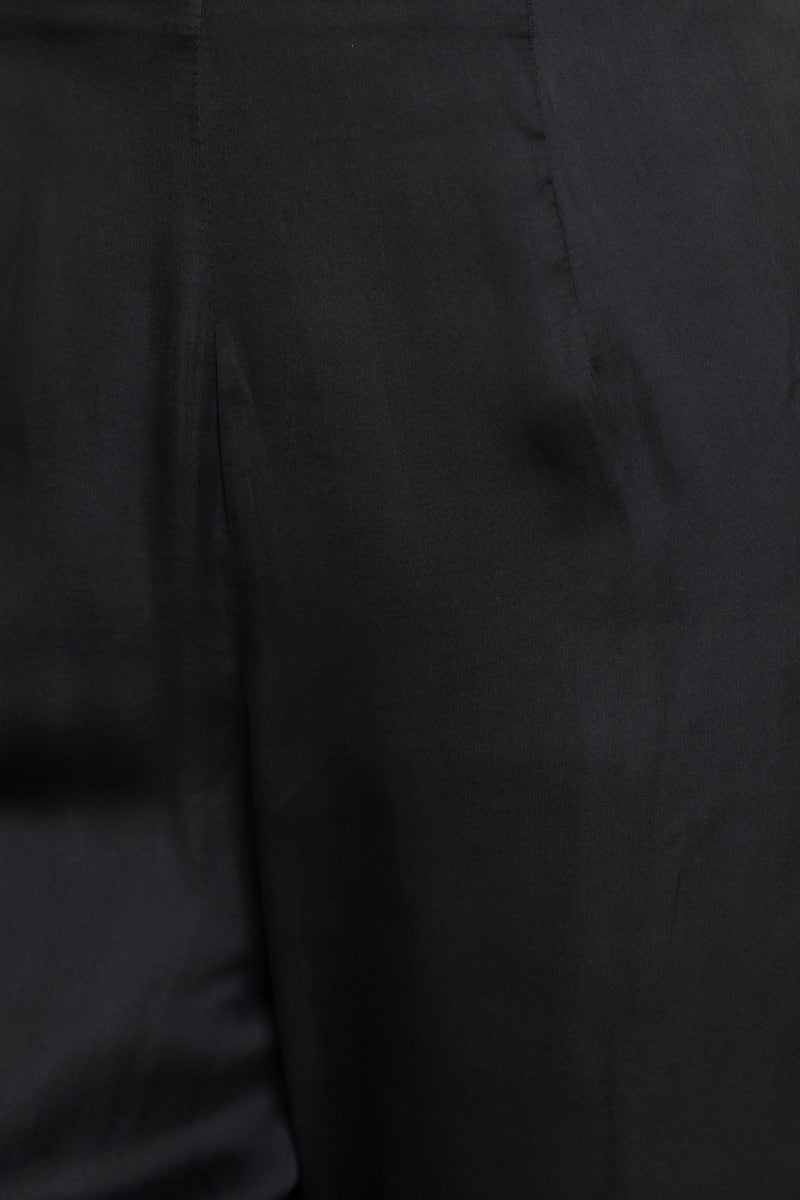 Close-up of the black satin fabric showcasing its smooth texture and sleek finish, ideal for the Show Stopper Top.
