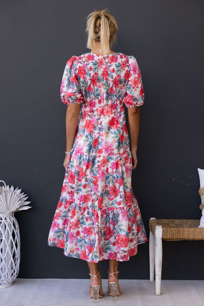 Back view of a floral print Ave Maxi Dress with elastic bodice and puff sleeves, perfect for summer wear.