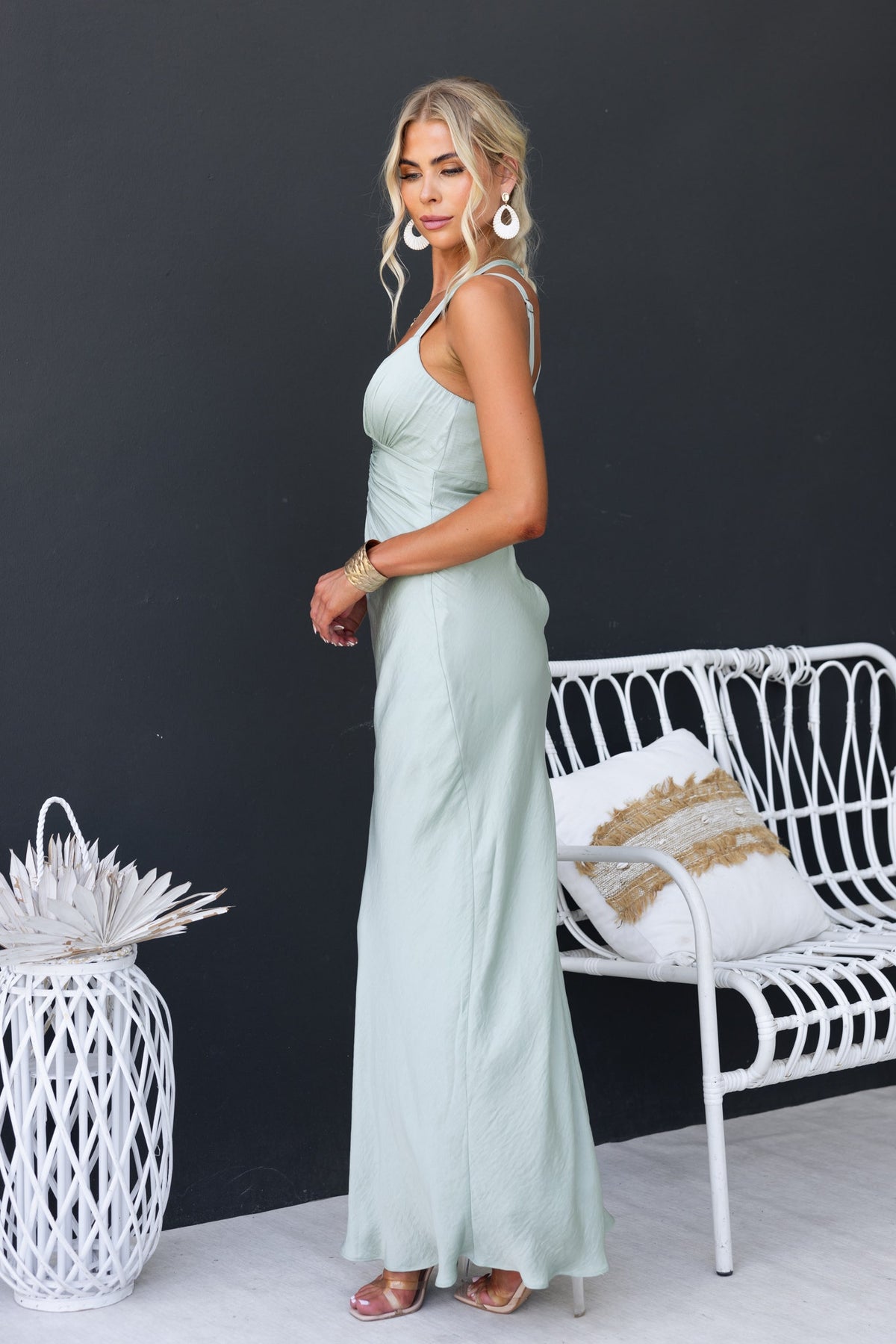 Model wearing a Laken Maxi Dress in mint green, featuring adjustable straps and a flowing silhouette.
