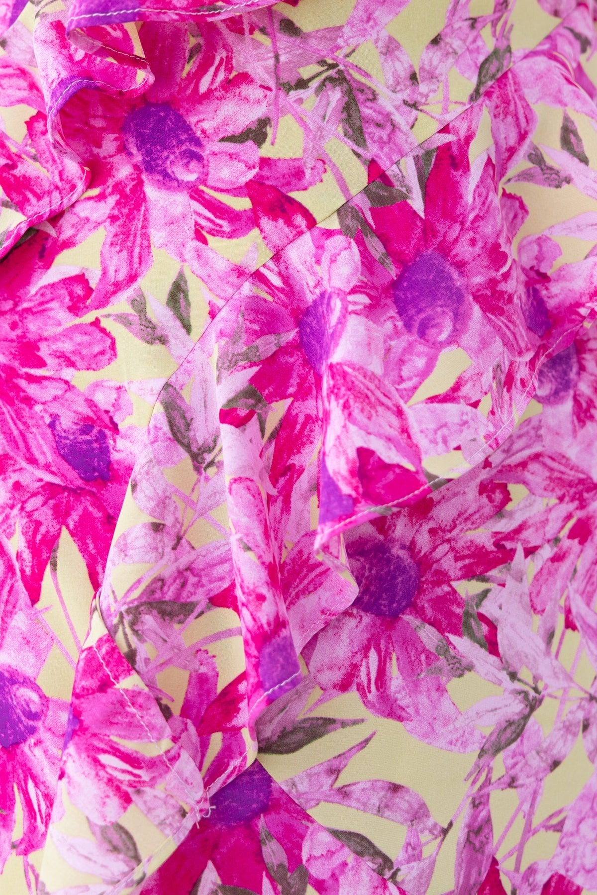 Close-up of vibrant floral print featuring pink and purple flowers on light fabric for Anissa Maxi Dress.