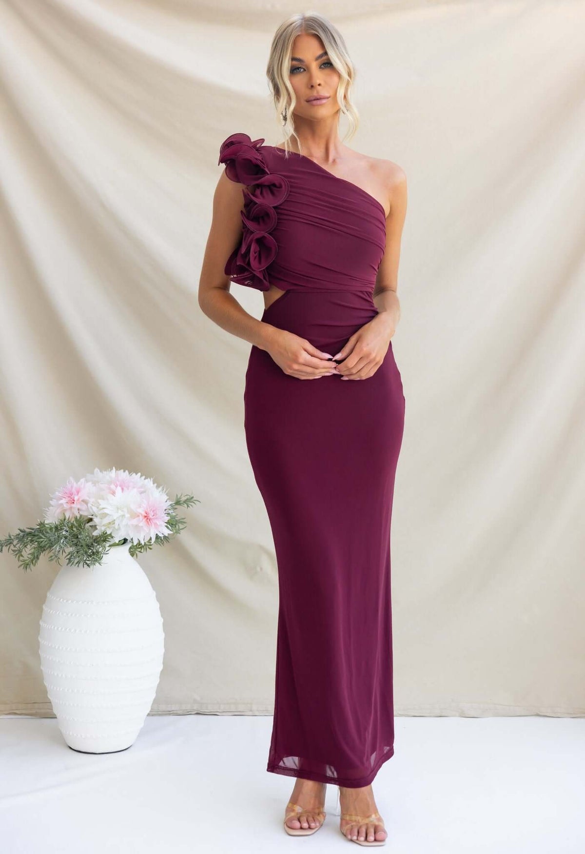 Elegant Meriden Maxi Dress featuring a one-shoulder neckline and floral accent, perfect for special occasions.