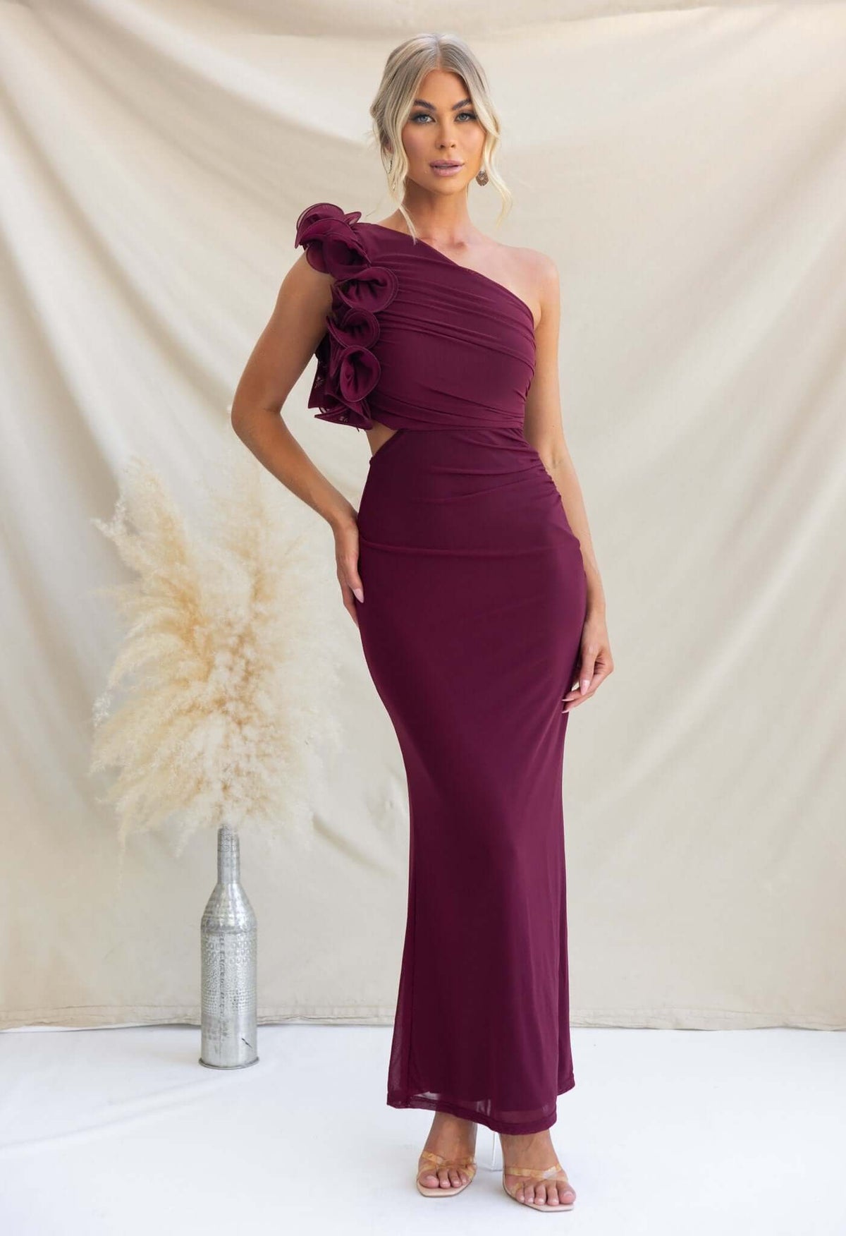 Meriden Maxi Dress in deep burgundy, featuring a one-shoulder neckline and floral detail, perfect for elegant occasions.