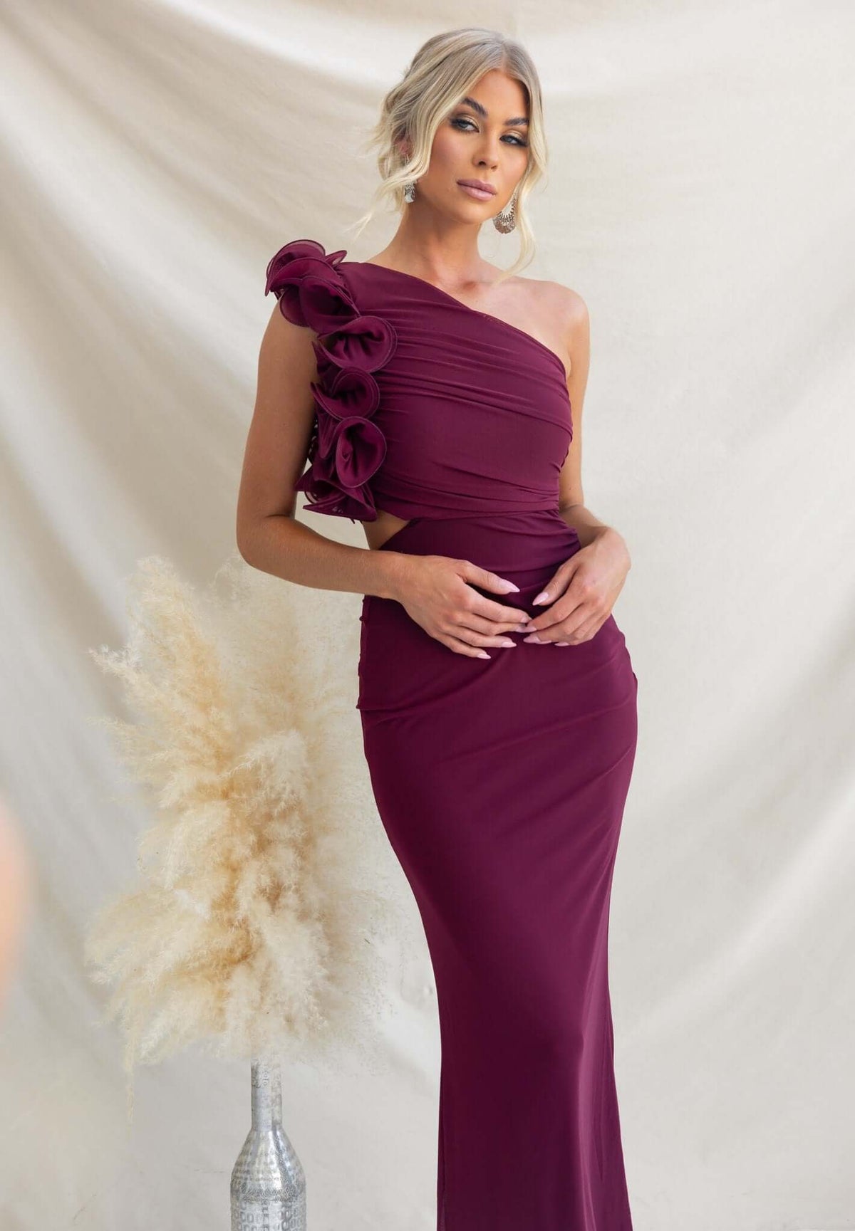 Meriden Maxi Dress with one-shoulder neckline and waist cut-out, displayed against a soft backdrop.