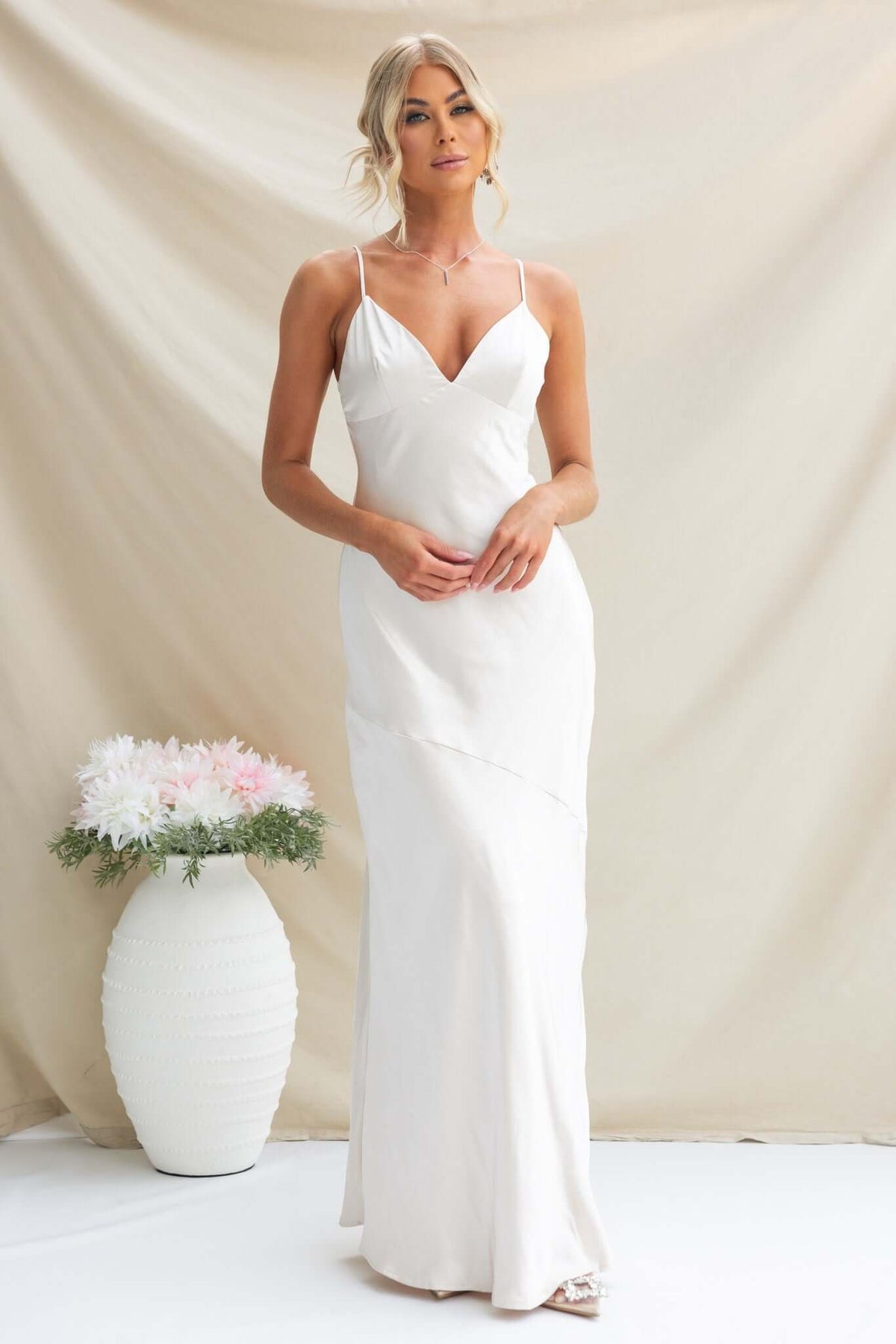 Elegant Coralina Maxi Dress with adjustable straps in satin material, perfect for formal occasions.