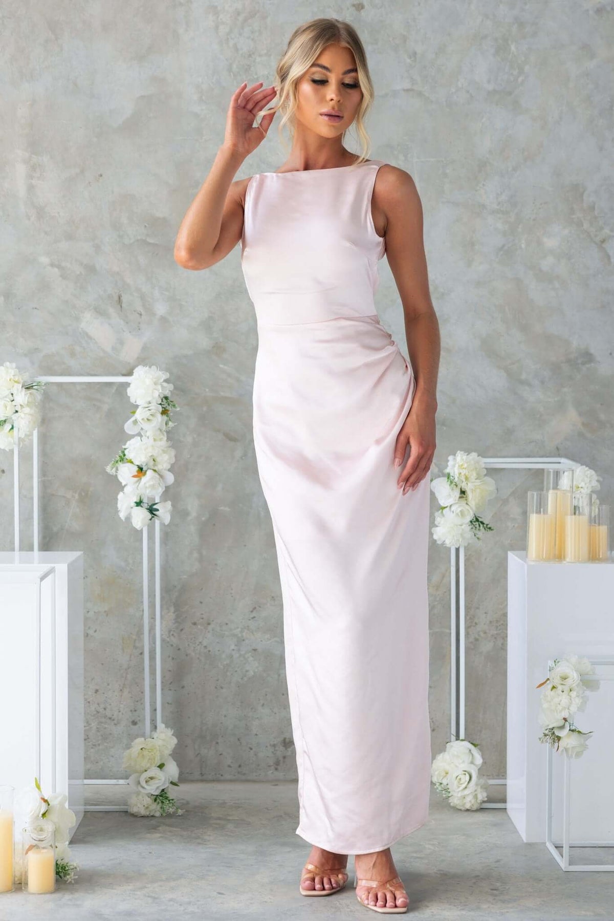 Dakari Maxi Dress in light pink satin, featuring high neckline, attached tie, and elegant back split.