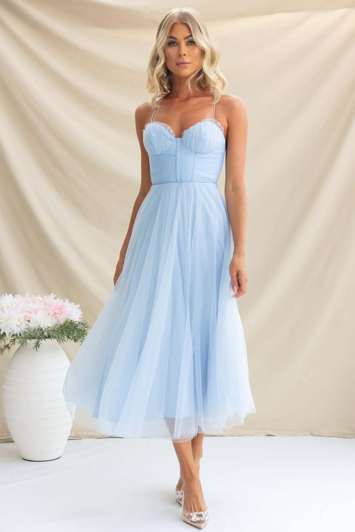 Light blue Florence Midi Dress featuring adjustable straps, padded bust, tulle material and a flowy skirt.