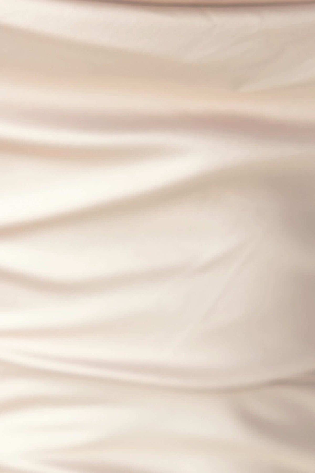 Close-up of soft, draped fabric of Ingrid Maxi Dress showcasing delicate texture and elegant design details.