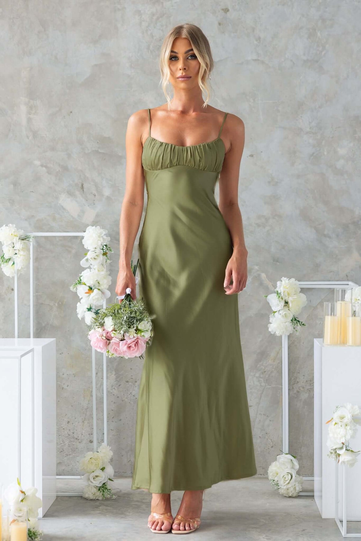 Celine Maxi Dress in olive green, featuring adjustable straps, gathered bust, and a cut-out back, perfect for weddings.