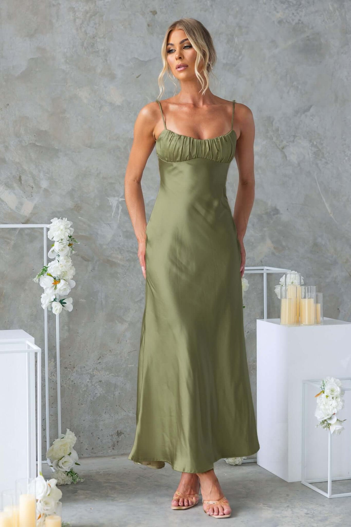 Celine Maxi Dress in olive green with adjustable straps and gathered bust, perfect for evening events or weddings.