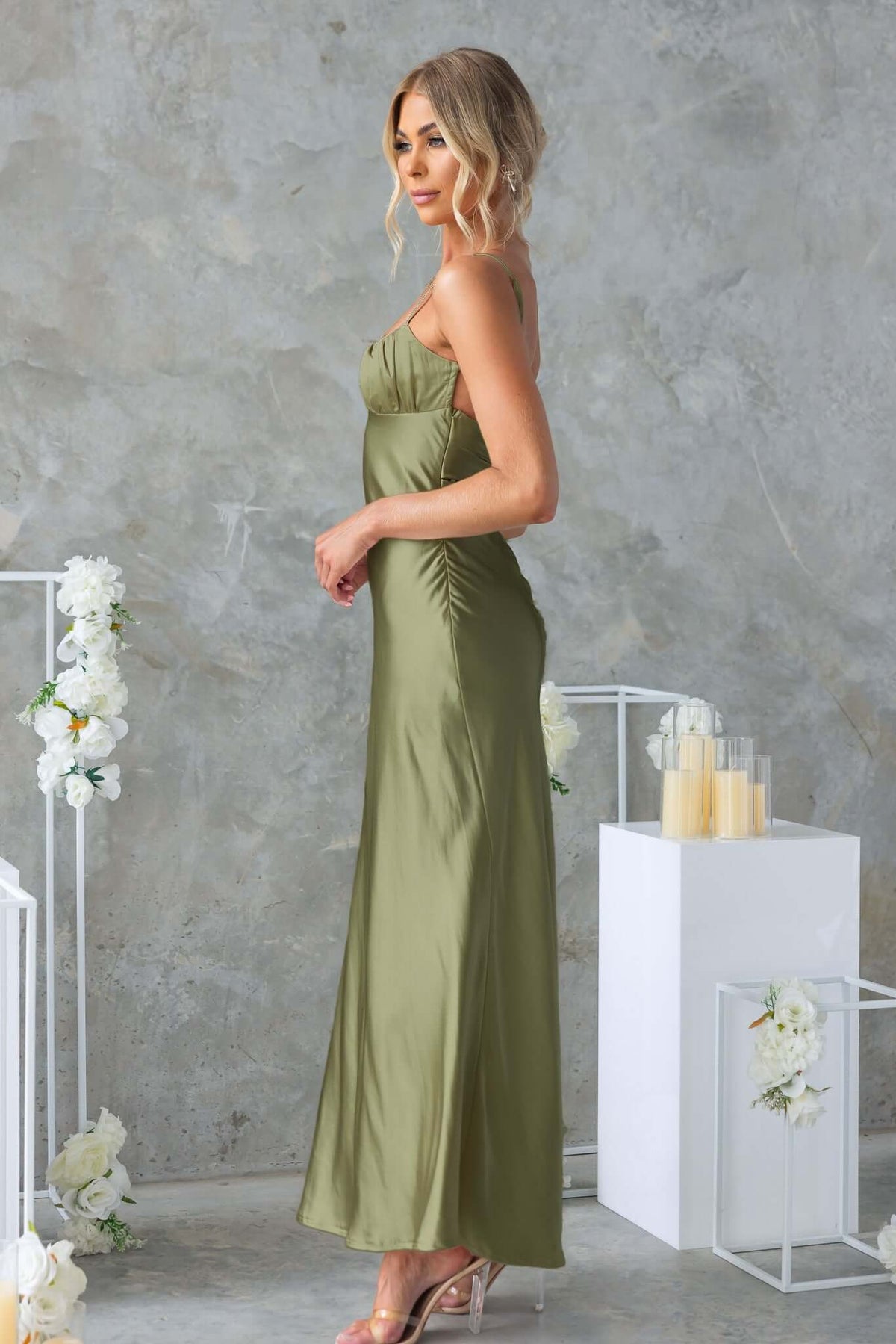 Model in a green Celine Maxi Dress showcasing adjustable straps and gathered bust detail.