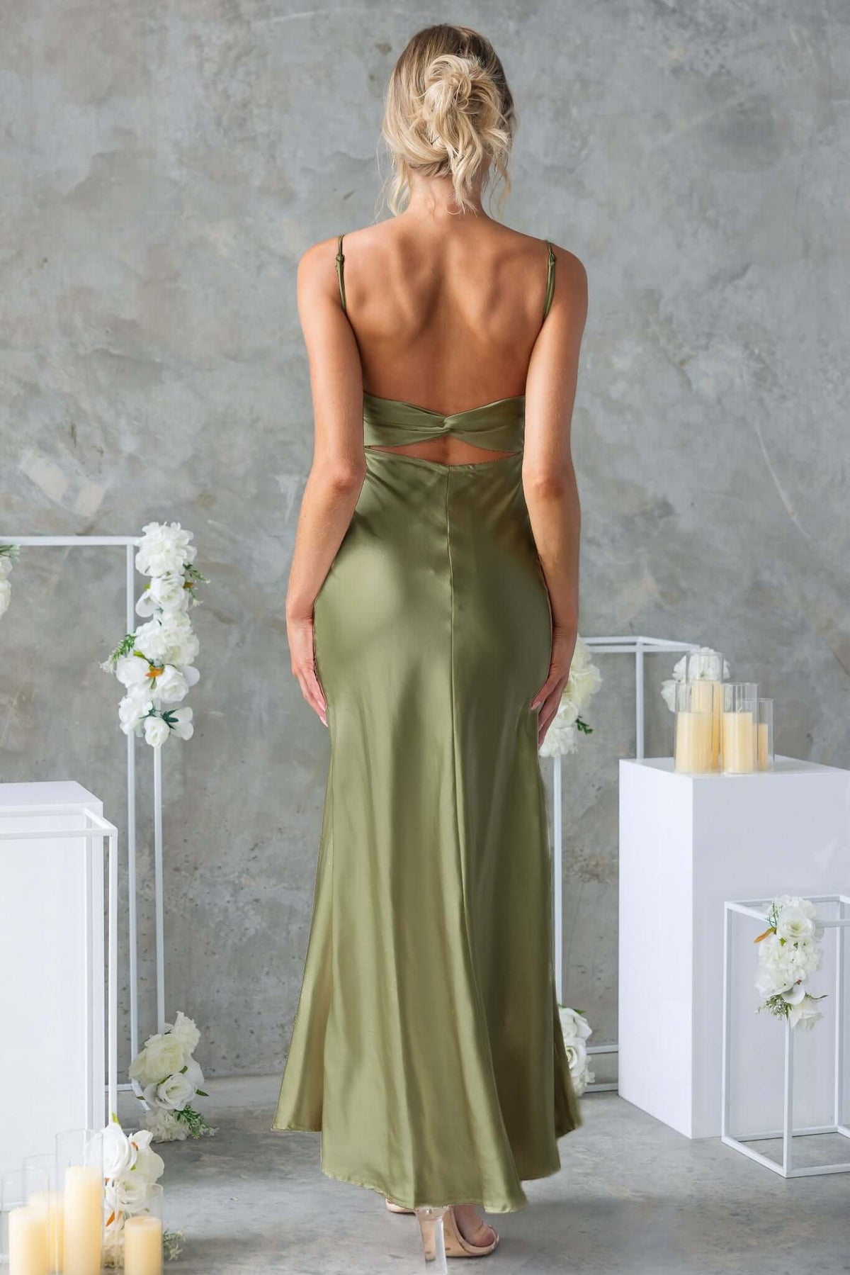 Back view of a Celine Maxi Dress in olive green with adjustable straps and cut-out detailing.