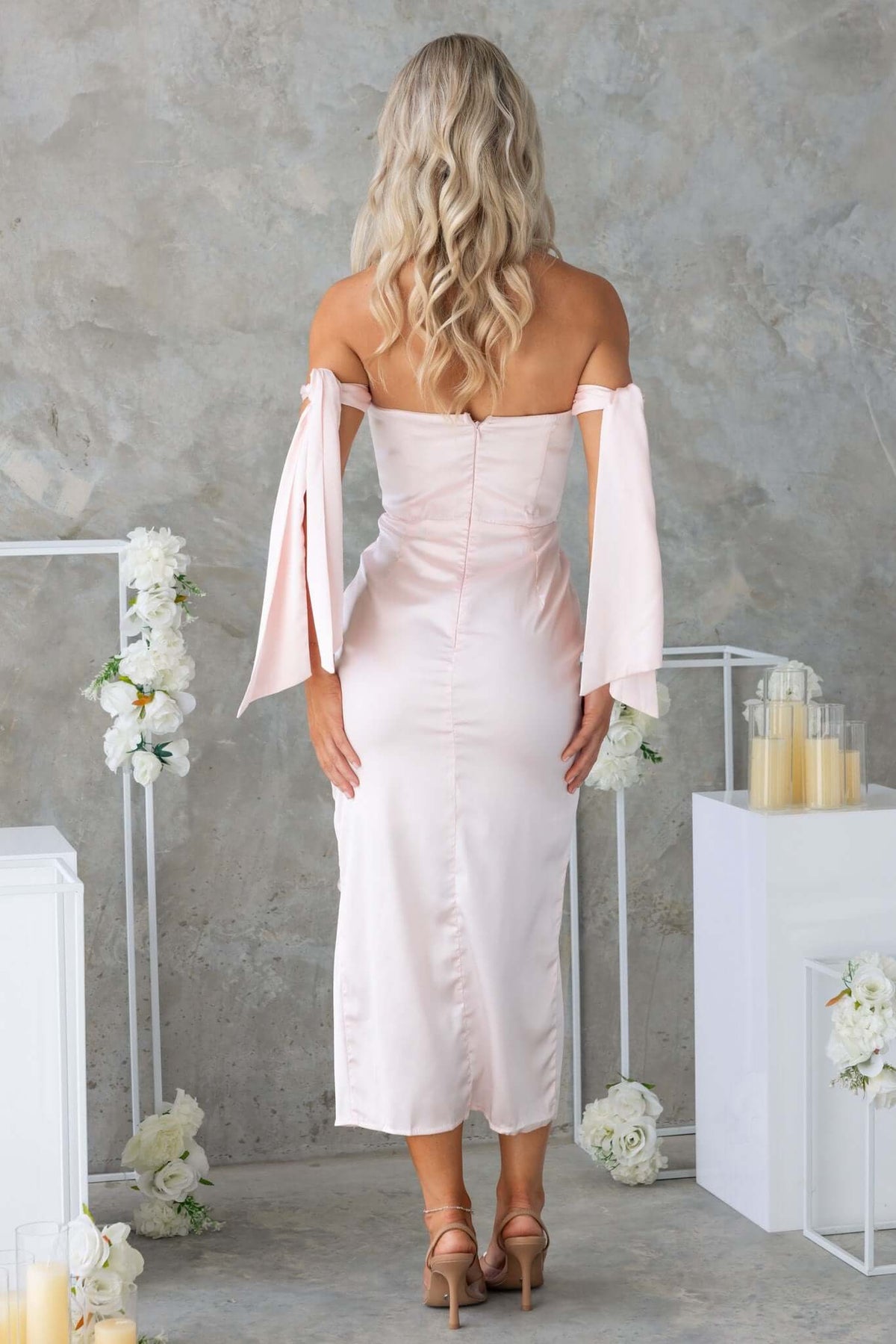 Elegant back view of Qandice Midi Dress in satin, featuring tie straps, asymmetrical hem, and lined design.
