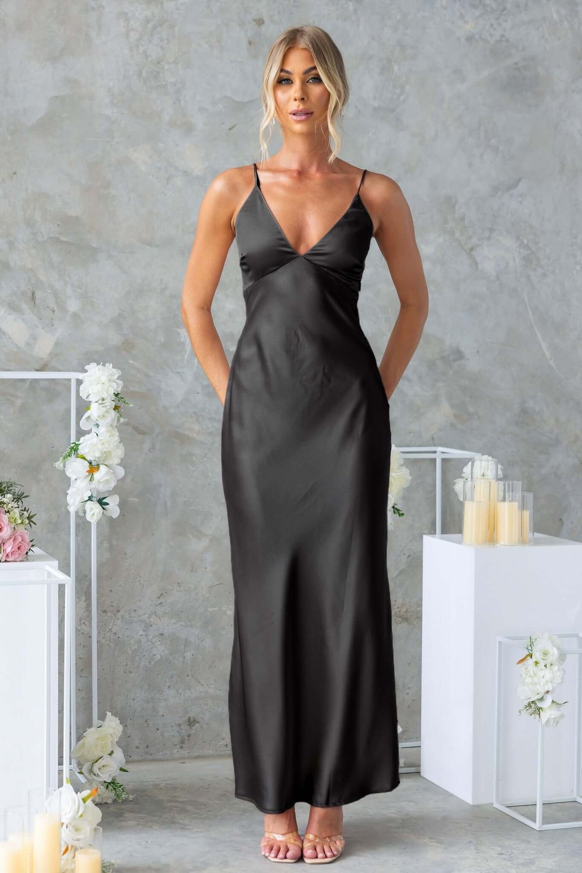 Hasina Maxi Dress in black satin with adjustable straps and v-neckline, perfect for formal occasions.