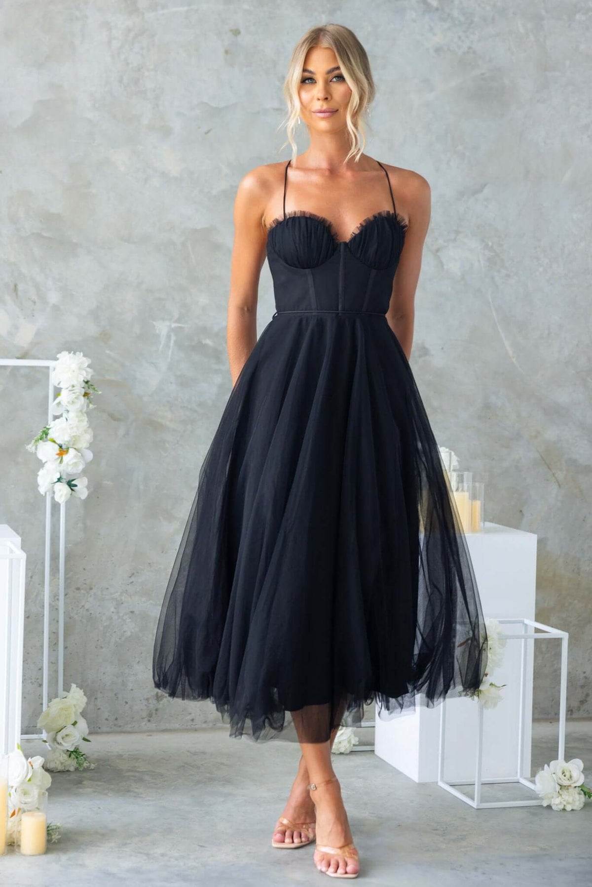 Florence Midi Dress in black, featuring adjustable straps, tulle material, and a stylish removable fabric tie.