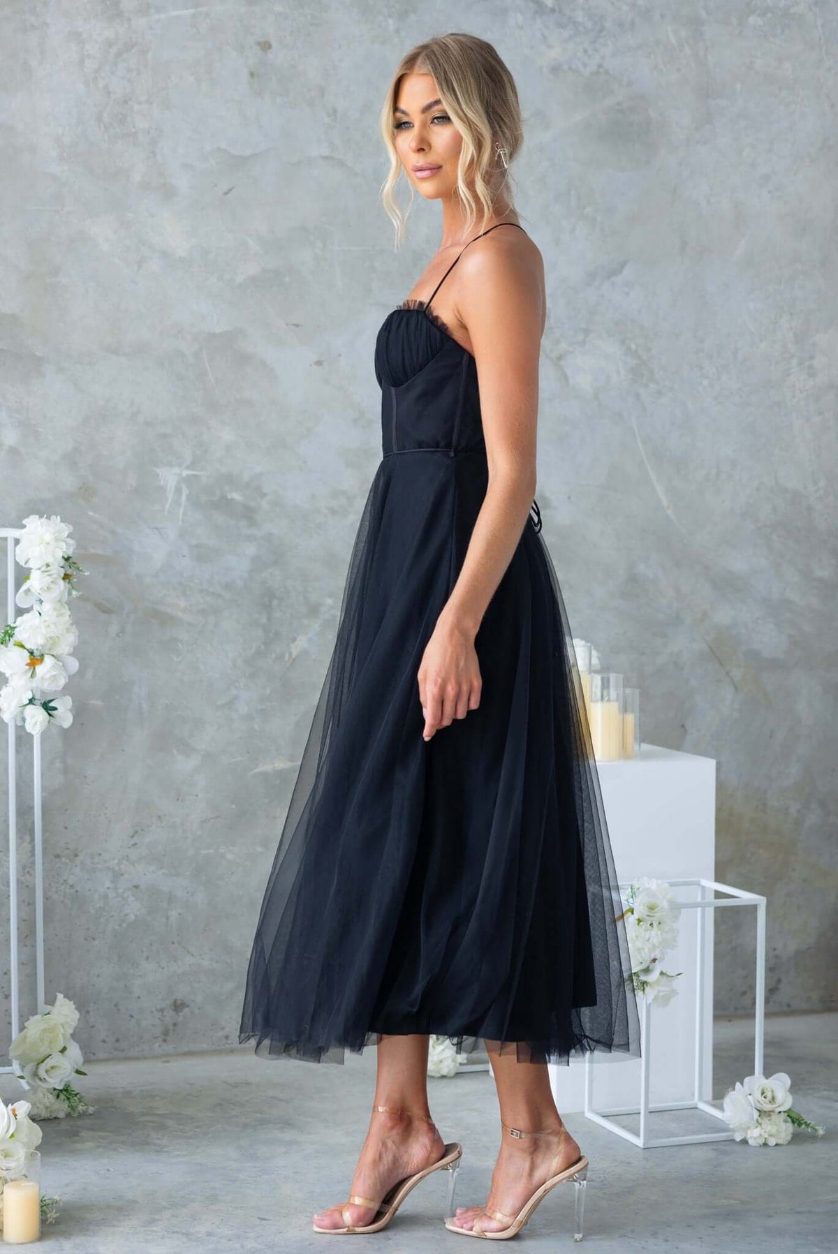 Florence Midi Dress in black with adjustable straps and tulle skirt, stylish and elegant for special occasions.