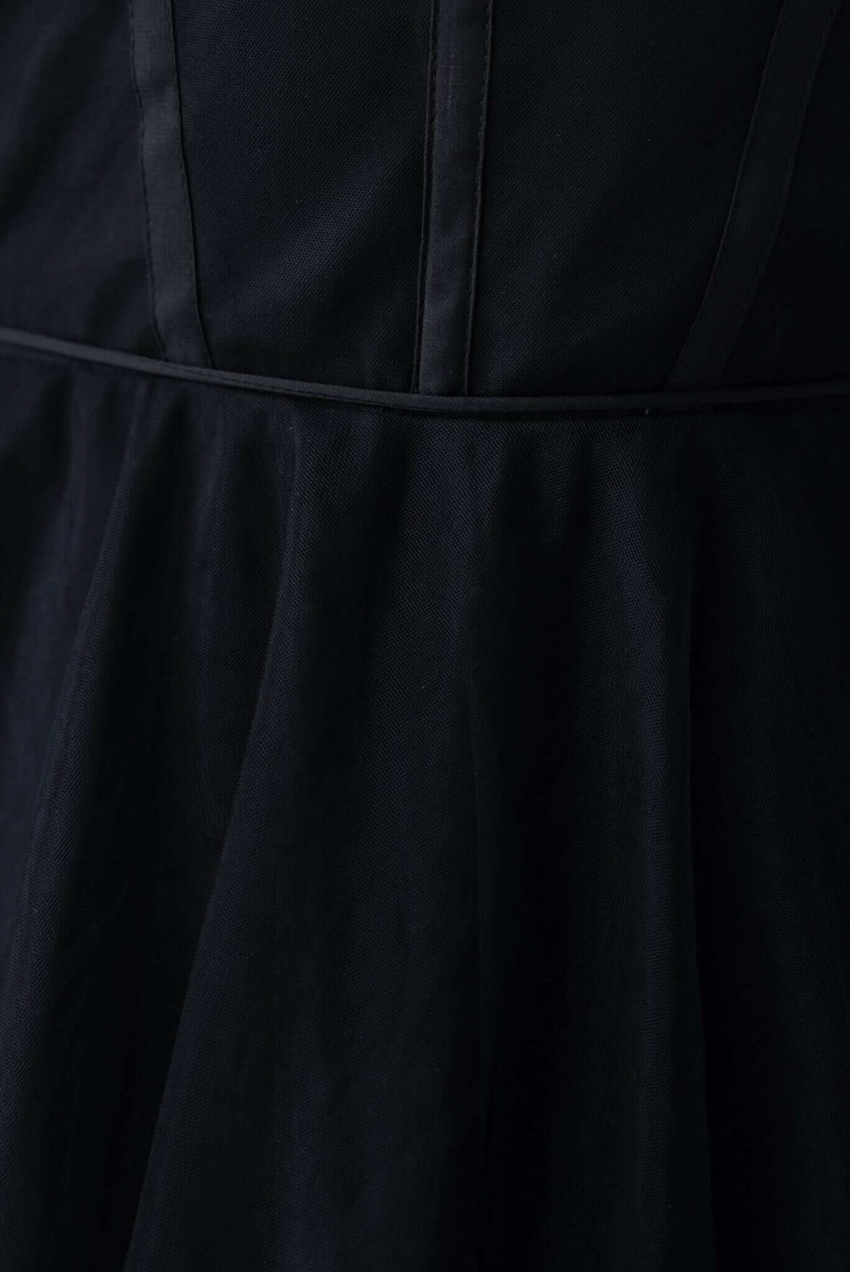 Close-up of the Florence Midi Dress showing black tulle fabric, adjustable straps, and flattering silhouette.